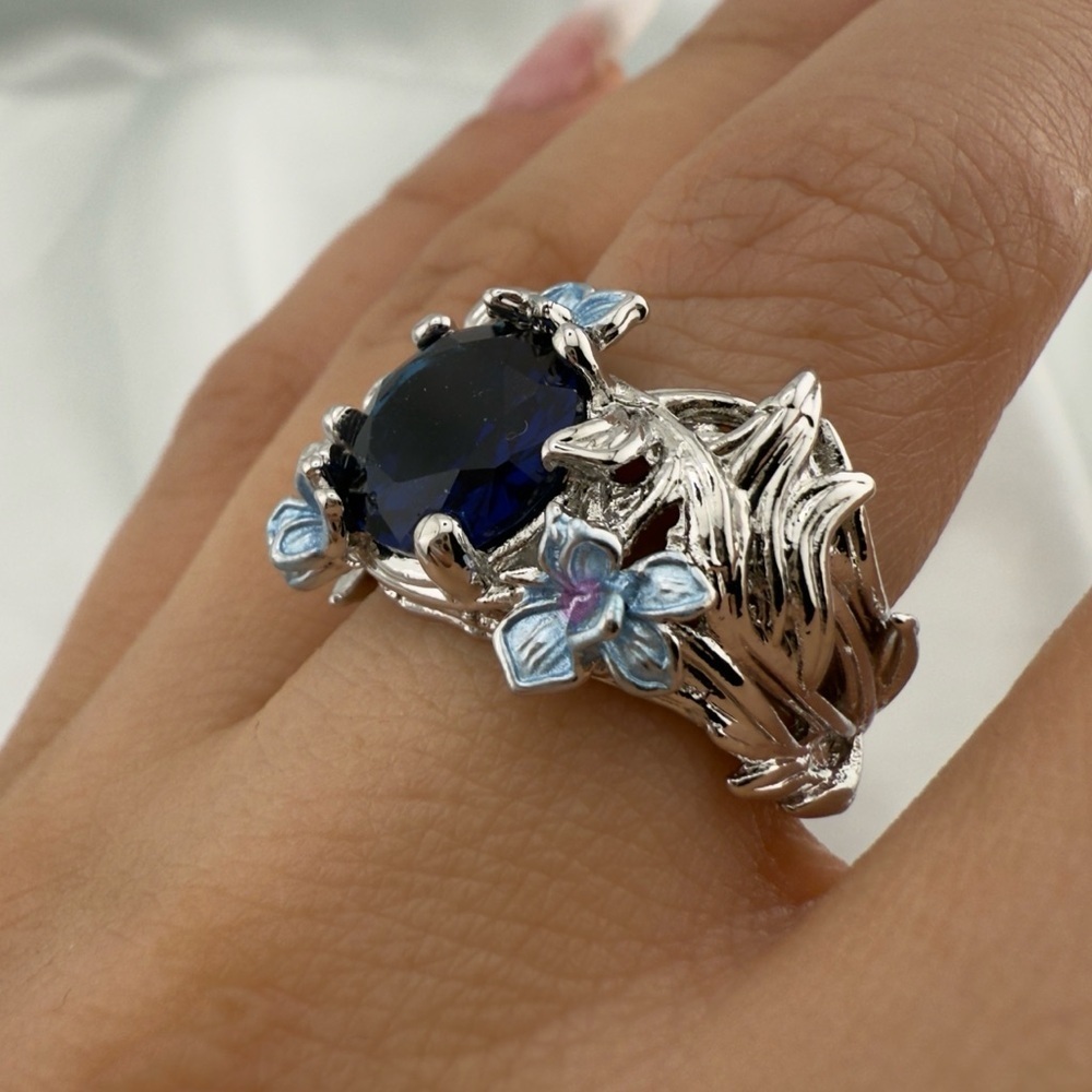 Anthropologie Silver Floral Ring with Deep Blue Stone and Light Blue Accents